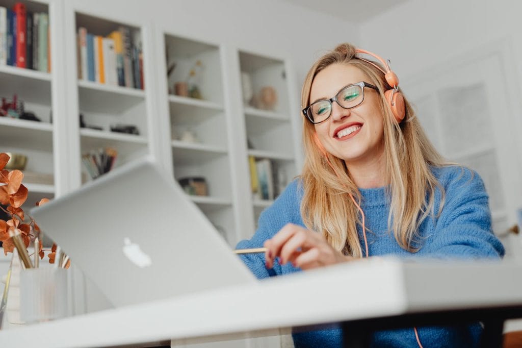 a-woman-smiling-using-laptop-5908493 A Woman Smiling using Laptop